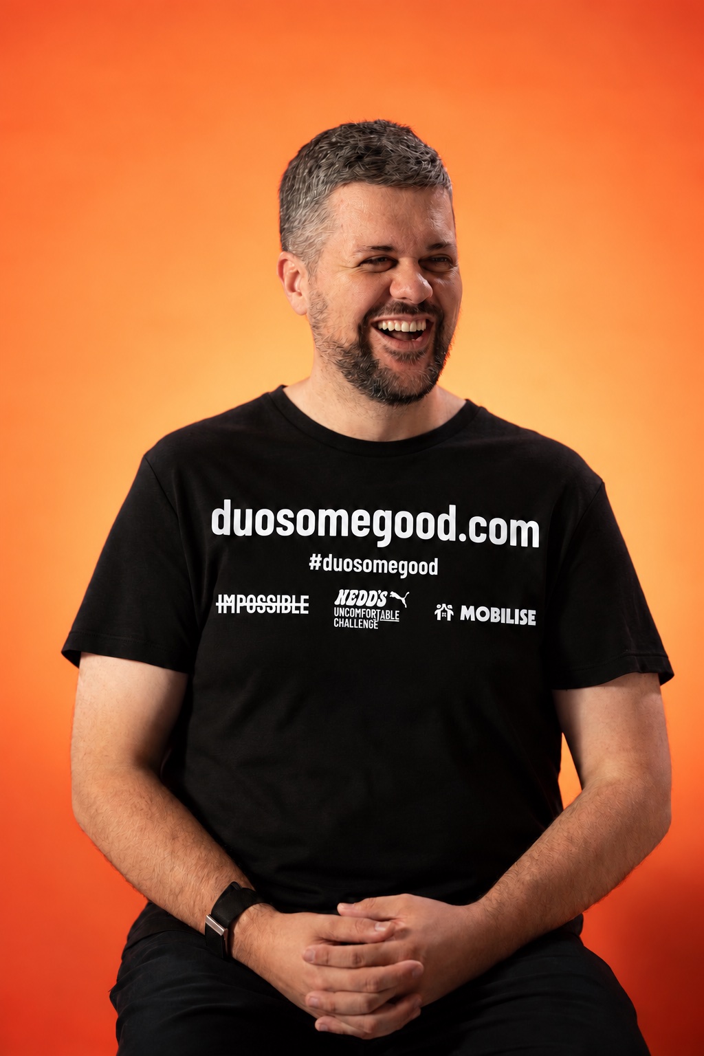 Jeremy Cabral wearing the Duo Some Good campaign T-shirt (design mockup)